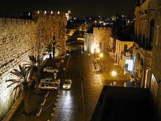 A picture of the Jaffa Gate at night.